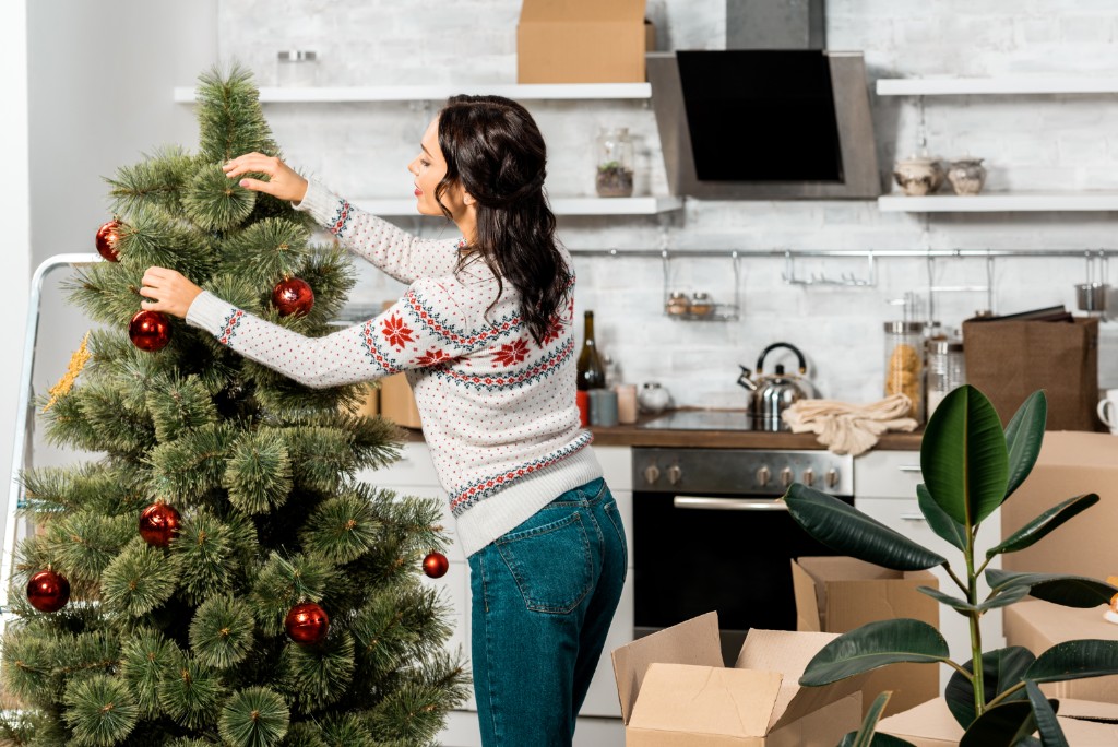 Girl Decorating Christmas Tree