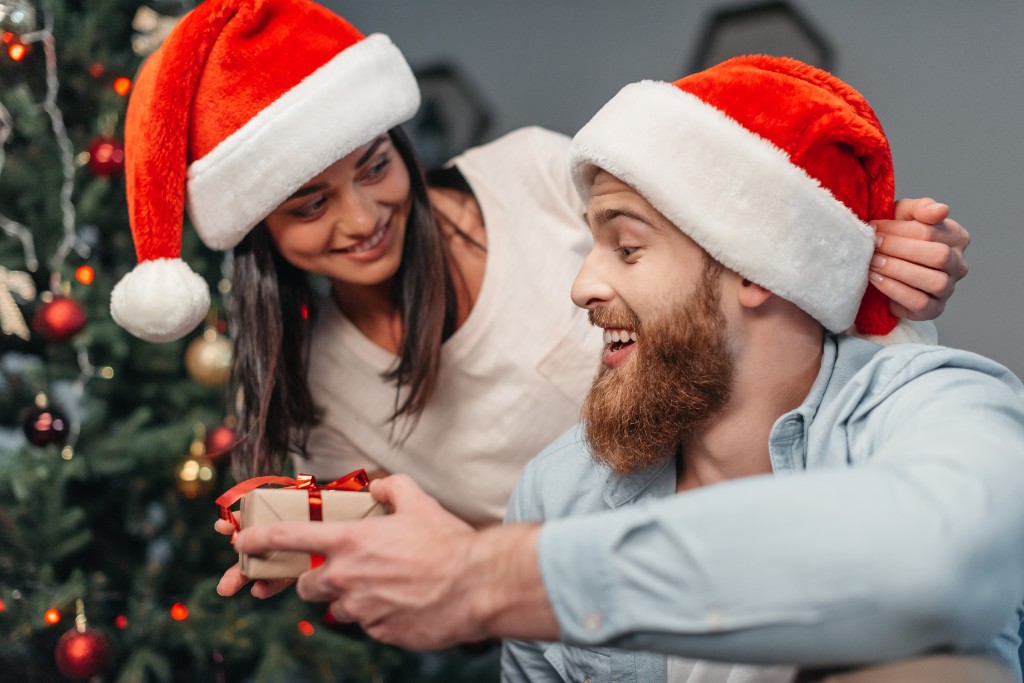 Couple Wearing Christmas Hats